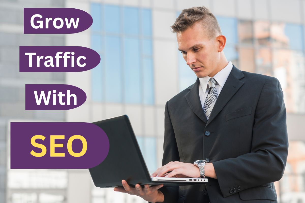 a guy using a laptop, thinking about growing traffic with seo
